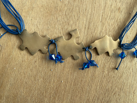 Ketting met puzzel elementen